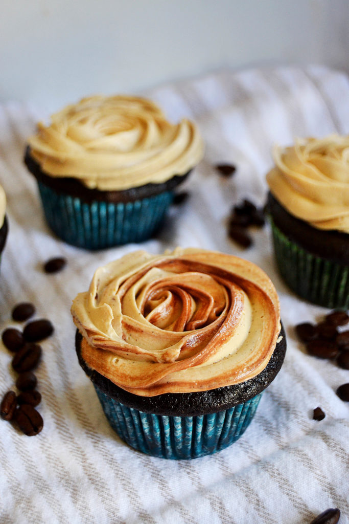 three mocha cupcakes with coffee buttercream