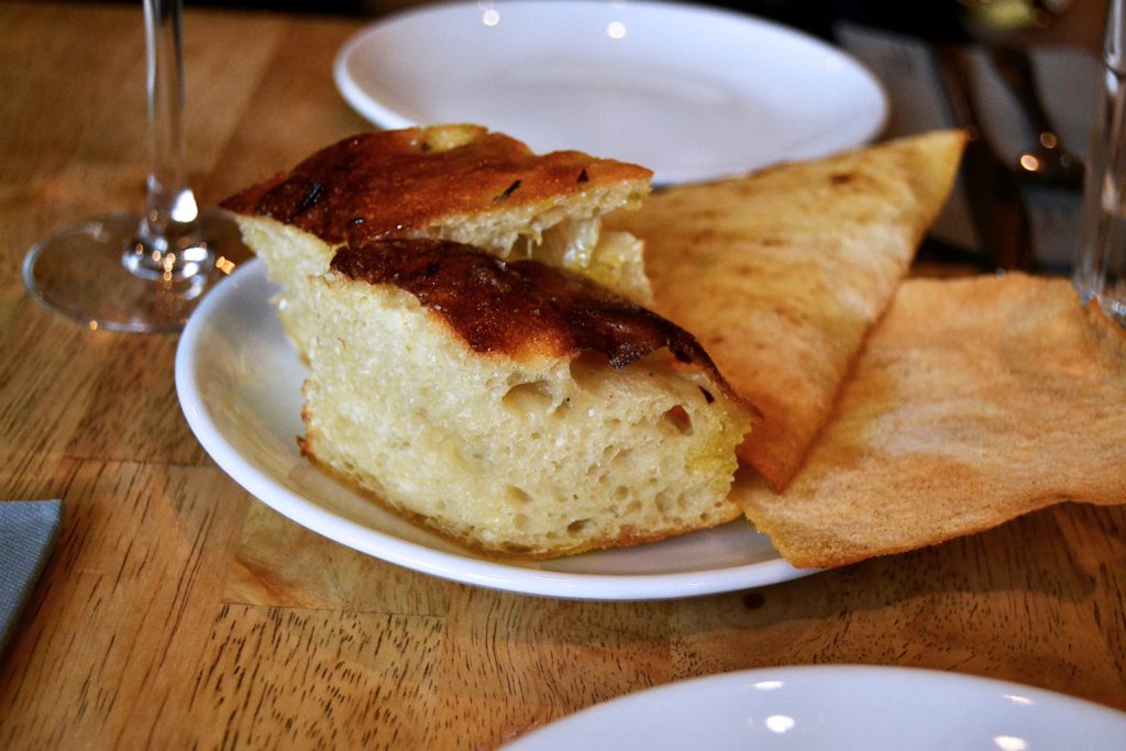 Focaccia and crispy bread with olive oil