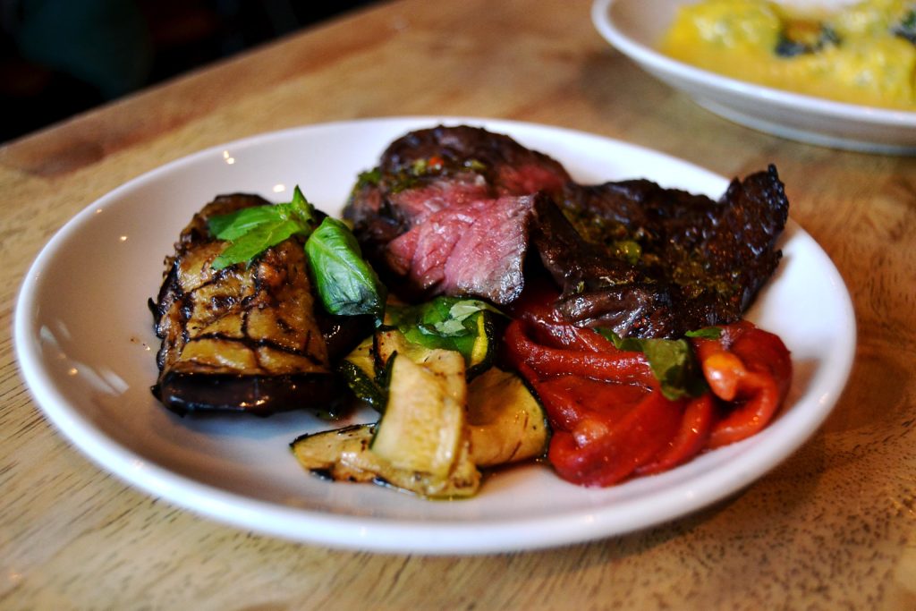 Steak with grilled vegetables and basil