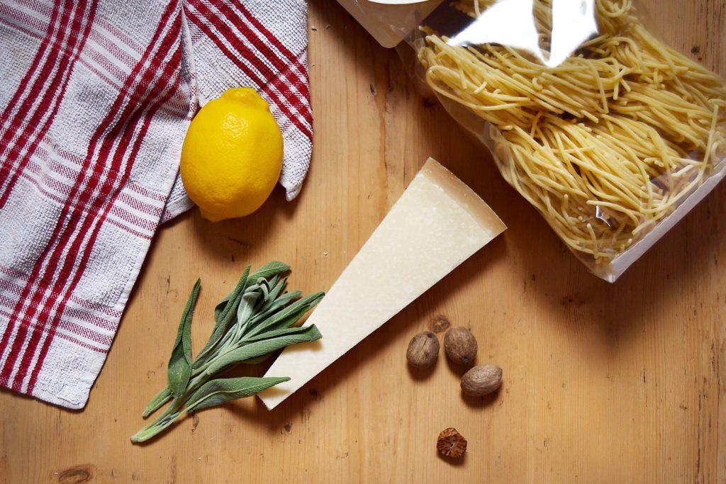 lemon sage parmesan nutmeg pasta on wood board